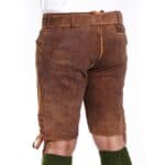 Brown leather shorts with side lacing and green socks on a person.